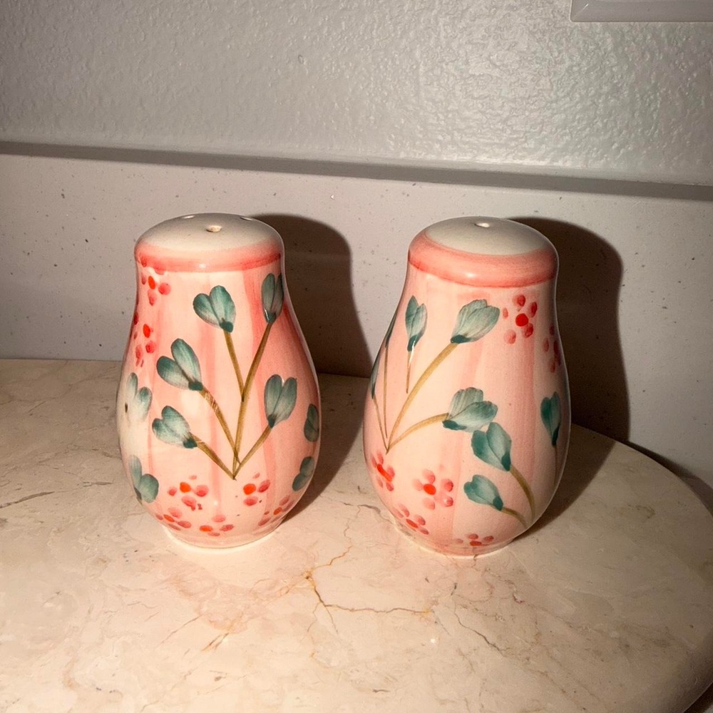 Handmade ceramic salt and pepper shakers w/ pink background & green/red floral